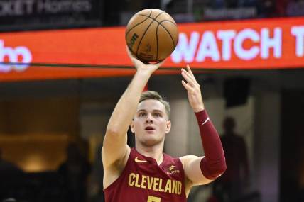 Nov 19, 2023; Cleveland, Ohio, USA; Cleveland Cavaliers guard Sam Merrill (5) shoots in the fourth quarter against the Denver Nuggets at Rocket Mortgage FieldHouse. Mandatory Credit: David Richard-USA TODAY Sports