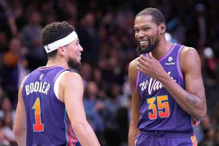 Nov 21, 2023; Phoenix, Arizona, USA; Phoenix Suns guard Devin Booker (1) and Phoenix Suns forward Kevin Durant (35) look on against the Portland Trail Blazers during the second half at Footprint Center. Mandatory Credit: Joe Camporeale-USA TODAY Sports