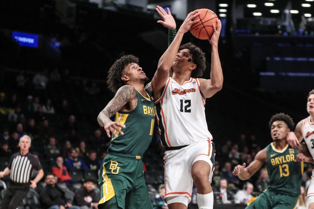 Nov 22, 2023; Brooklyn, NY, USA; Oregon State Beavers forward Michael Rataj (12) looks to drive past Baylor Bears forward Jalen Bridges (11) in the first half at Barclay Center. Mandatory Credit: Wendell Cruz-USA TODAY Sports