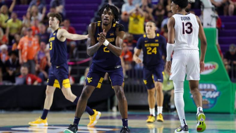 Nov 22, 2023; Fort Myers, FL, USA;  West Virginia Mountaineers guard Kobe Johnson (2) reacts after a play against the Virginia Cavaliers in the second half during the Fort Myers Tip-Off third place game at Suncoast Credit Union Arena. Mandatory Credit: Nathan Ray Seebeck-USA TODAY Sports