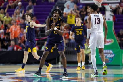 Nov 22, 2023; Fort Myers, FL, USA;  West Virginia Mountaineers guard Kobe Johnson (2) reacts after a play against the Virginia Cavaliers in the second half during the Fort Myers Tip-Off third place game at Suncoast Credit Union Arena. Mandatory Credit: Nathan Ray Seebeck-USA TODAY Sports