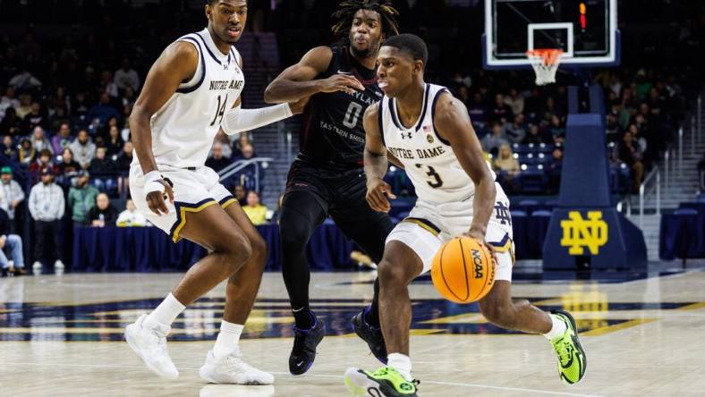 Notre Dame guard Markus Burton (3) drives to the basket as Maryland Eastern Shore guard Toby Nnadozie (0) defends during the Maryland Eastern Shore-Notre Dame NCAA Men   s basketball game on Wednesday, November 22, 2023, at Purcell Pavilion in South Bend, Indiana.