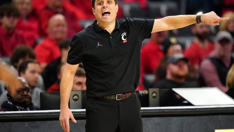 Cincinnati Bearcats head coach Wes Miller instructs the team in the second half during an NCAA college basketball game between Georgia Tech Yellow Jackets and the Cincinnati Bearcats, Wednesday, Nov. 22, 2023, at Fifth Third Arena in Cincinnati.