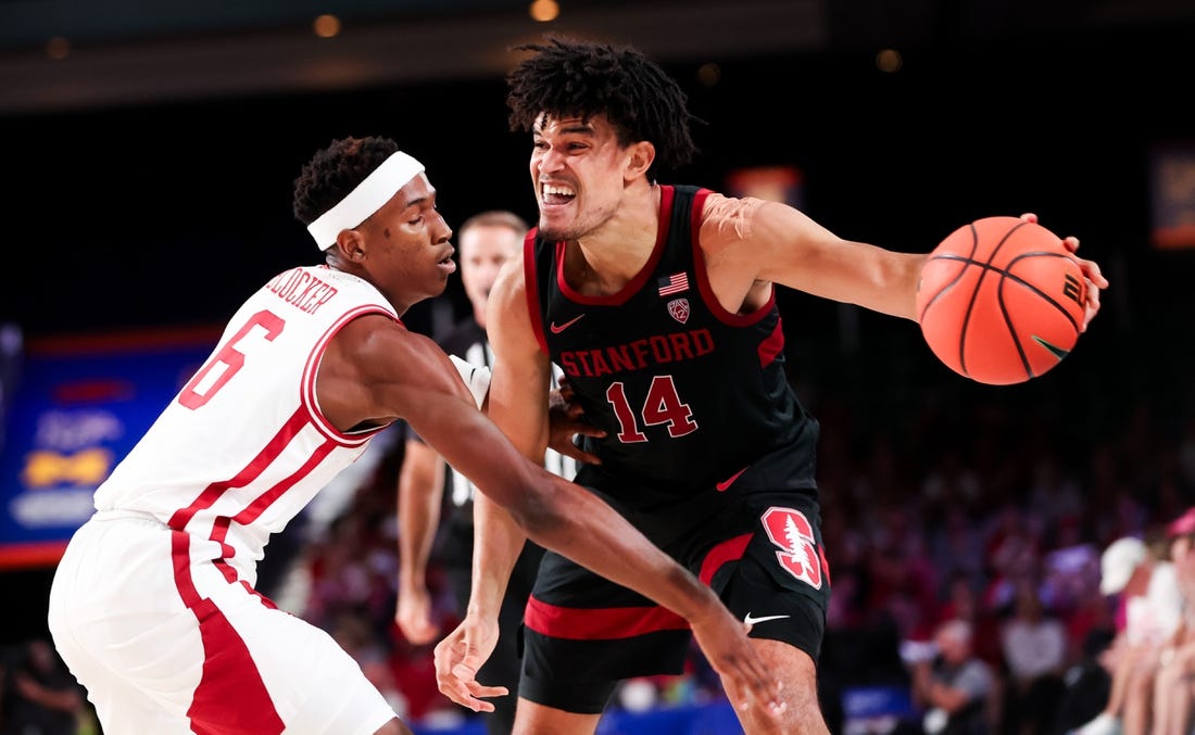 Nov 22, 2023; Paradise Island, BAHAMAS;  Stanford Cardinal forward Spencer Jones (14) controls the ball as Arkansas Razorbacks guard Layden Blocker (6) defends during the second half at Imperial Arena. Mandatory Credit: Kevin Jairaj-USA TODAY Sports