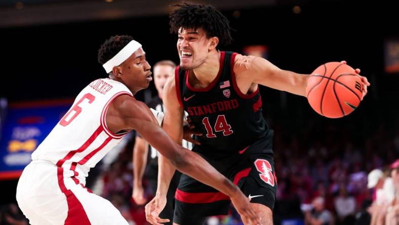 Nov 22, 2023; Paradise Island, BAHAMAS;  Stanford Cardinal forward Spencer Jones (14) controls the ball as Arkansas Razorbacks guard Layden Blocker (6) defends during the second half at Imperial Arena. Mandatory Credit: Kevin Jairaj-USA TODAY Sports