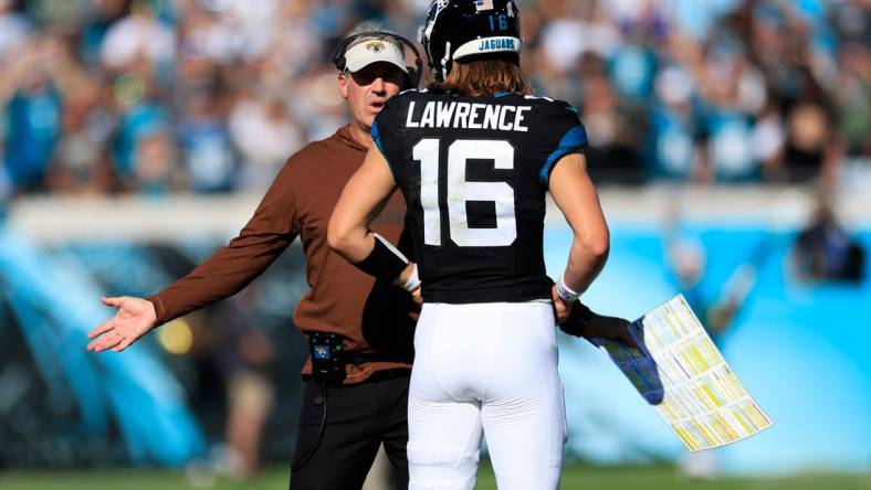 Jacksonville Jaguars head coach Doug Pederson talks with quarterback Trevor Lawrence (16) during the second quarter an NFL football matchup Sunday, Nov. 19, 2023 at EverBank Stadium in Jacksonville, Fla. The Jacksonville Jaguars defeated the Tennessee Titans 34-14. [Corey Perrine/Florida Times-Union]