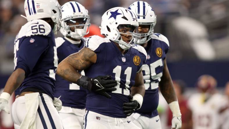 Nov 23, 2023; Arlington, Texas, USA; Dallas Cowboys linebacker Micah Parsons (11) celebrates a sack of Washington Commanders quarterback Sam Howell (not pictured) in the fourth quarter at AT&T Stadium. Mandatory Credit: Tim Heitman-USA TODAY Sports