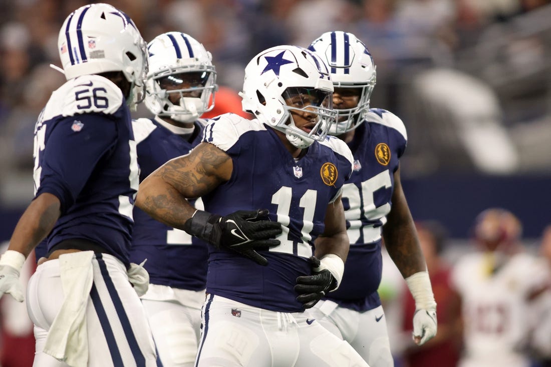 Nov 23, 2023; Arlington, Texas, USA; Dallas Cowboys linebacker Micah Parsons (11) celebrates a sack of Washington Commanders quarterback Sam Howell (not pictured) in the fourth quarter at AT&T Stadium. Mandatory Credit: Tim Heitman-USA TODAY Sports