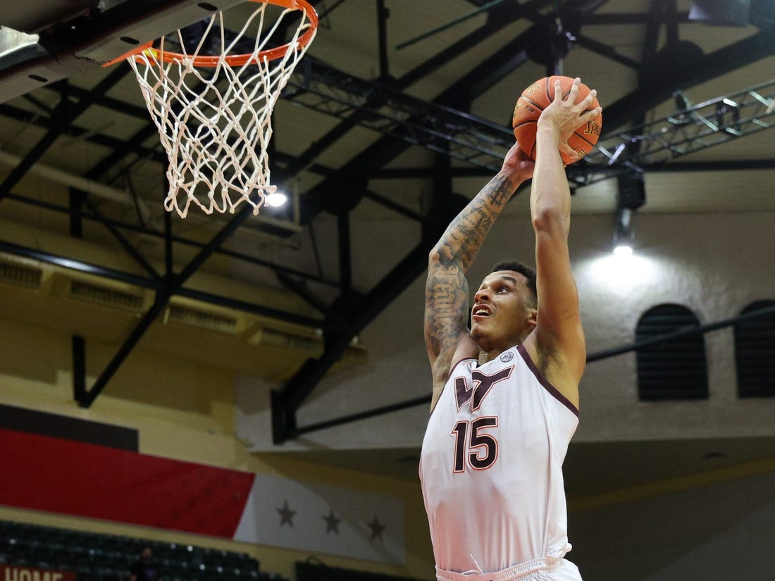 Nov 23, 2023; Kissimmee, FL, USA;  Virginia Tech Hokies center Lynn Kidd (15) dunks the ball against the Boise State Broncos in the second half during the ESPN Events Invitational at State Farm Field House. Mandatory Credit: Nathan Ray Seebeck-USA TODAY Sports