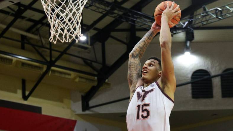 Nov 23, 2023; Kissimmee, FL, USA;  Virginia Tech Hokies center Lynn Kidd (15) dunks the ball against the Boise State Broncos in the second half during the ESPN Events Invitational at State Farm Field House. Mandatory Credit: Nathan Ray Seebeck-USA TODAY Sports