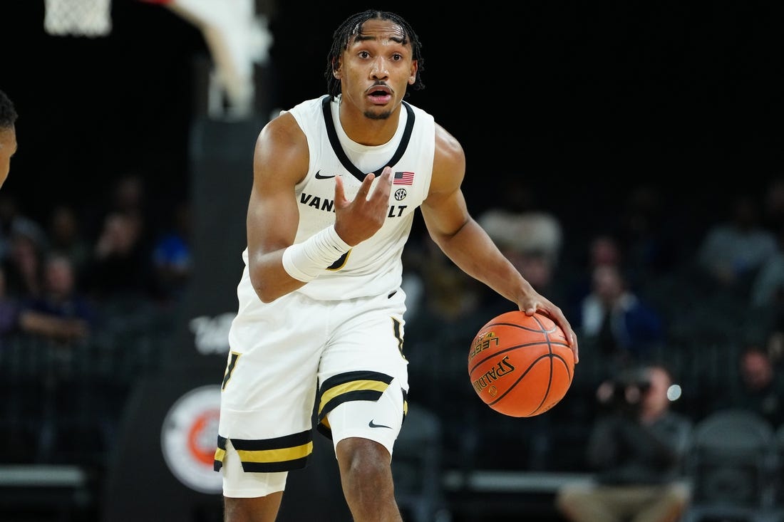 Nov 23, 2023; Las Vegas, Nevada, USA; Vanderbilt Commodores guard Tyrin Lawrence (0) dribbles against the North Carolina State Wolfpack during the first half at Michelob Ultra Arena. Mandatory Credit: Stephen R. Sylvanie-USA TODAY Sports