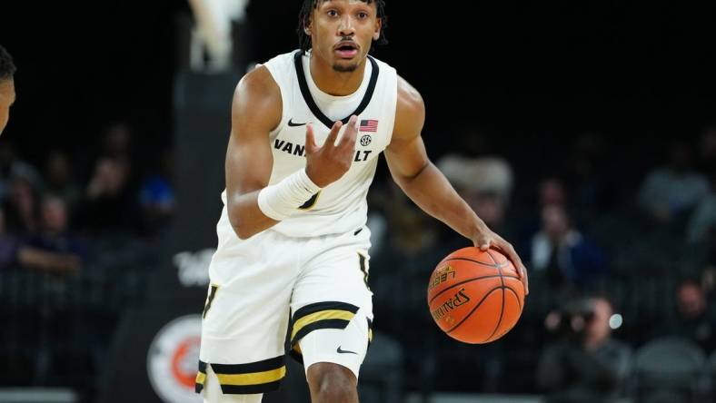 Nov 23, 2023; Las Vegas, Nevada, USA; Vanderbilt Commodores guard Tyrin Lawrence (0) dribbles against the North Carolina State Wolfpack during the first half at Michelob Ultra Arena. Mandatory Credit: Stephen R. Sylvanie-USA TODAY Sports