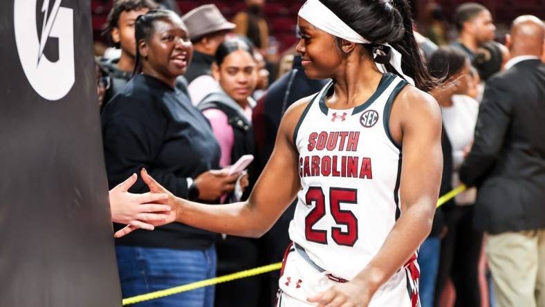 Nov 24, 2023; Columbia, South Carolina, USA; South Carolina Gamecocks guard Raven Johnson (25) high fives a fan after their win over the Mississippi Valley State Devilettes at Colonial Life Arena. Mandatory Credit: Jeff Blake-USA TODAY Sports