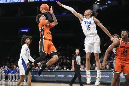 Nov 24, 2023; Brooklyn, NY, USA;  Oregon State Beavers guard Dexter Akanno (4) shoots the ball over Pittsburgh Panthers guard Jaland Lowe (15) in the second half at Barclay Center. Mandatory Credit: Wendell Cruz-USA TODAY Sports