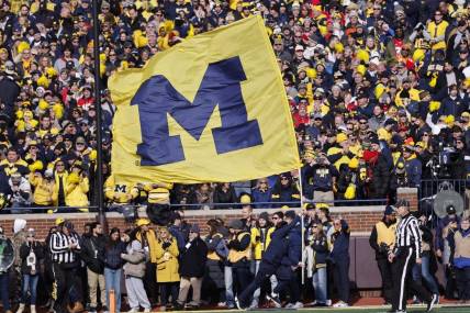 Nov 25, 2023; Ann Arbor, Michigan, USA; Michigan Wolverines cheerleader celebrates a touchdown against the Ohio State Buckeyes in the first half at Michigan Stadium. Mandatory Credit: Rick Osentoski-USA TODAY Sports