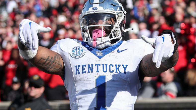 Kentucky Wildcats running back Ray Davis (1) reacts after scoring in the third quarter at Louisville on Nov. 25, 2023.