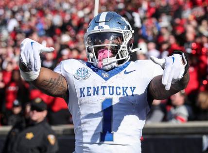 Kentucky Wildcats running back Ray Davis (1) reacts after scoring in the third quarter at Louisville on Nov. 25, 2023.