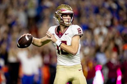 Florida State Seminoles quarterback Tate Rodemaker (18) throws the ball during the first half against the Florida Gators at Steve Spurrier Field at Ben Hill Griffin Stadium in Gainesville, FL on Saturday, November 25, 2023. [Matt Pendleton/Gainesville Sun]