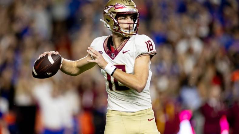 Florida State Seminoles quarterback Tate Rodemaker (18) throws the ball during the first half against the Florida Gators at Steve Spurrier Field at Ben Hill Griffin Stadium in Gainesville, FL on Saturday, November 25, 2023. [Matt Pendleton/Gainesville Sun]