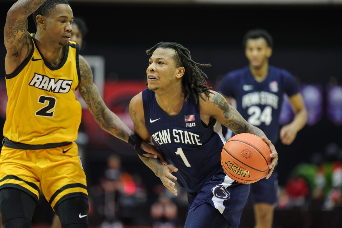 Nov 26, 2023; Kissimmee, FL, USA;  Penn State Nittany Lions guard Ace Baldwin Jr. (1) drives to the hoop past Virginia Commonwealth Rams guard Zeb Jackson (2) in the second half during the ESPN Invitational Events tournament seventh place game at State Farm Field House. Mandatory Credit: Nathan Ray Seebeck-USA TODAY Sports