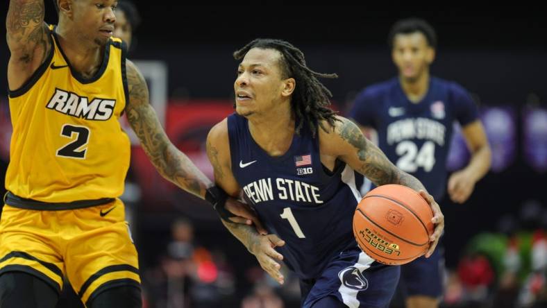 Nov 26, 2023; Kissimmee, FL, USA;  Penn State Nittany Lions guard Ace Baldwin Jr. (1) drives to the hoop past Virginia Commonwealth Rams guard Zeb Jackson (2) in the second half during the ESPN Invitational Events tournament seventh place game at State Farm Field House. Mandatory Credit: Nathan Ray Seebeck-USA TODAY Sports