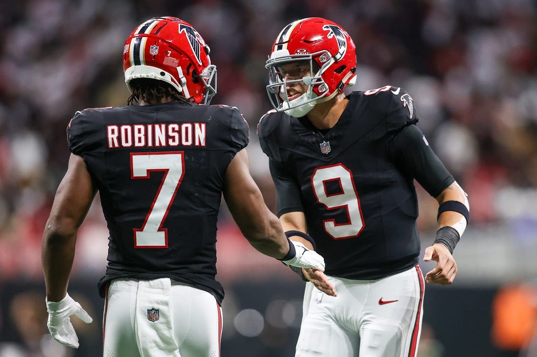 Nov 26, 2023; Atlanta, Georgia, USA; Atlanta Falcons running back Bijan Robinson (7) celebrates after a touchdown with quarterback Desmond Ridder (9) against the New Orleans Saints in the second quarter at Mercedes-Benz Stadium. Mandatory Credit: Brett Davis-USA TODAY Sports