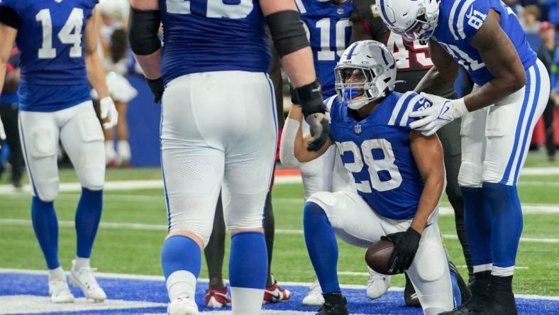 Indianapolis Colts running back Jonathan Taylor (28) scores a touchdown Sunday, Nov. 26, 2023, during a game against the Tampa Bay Buccaneers at Lucas Oil Stadium in Indianapolis.