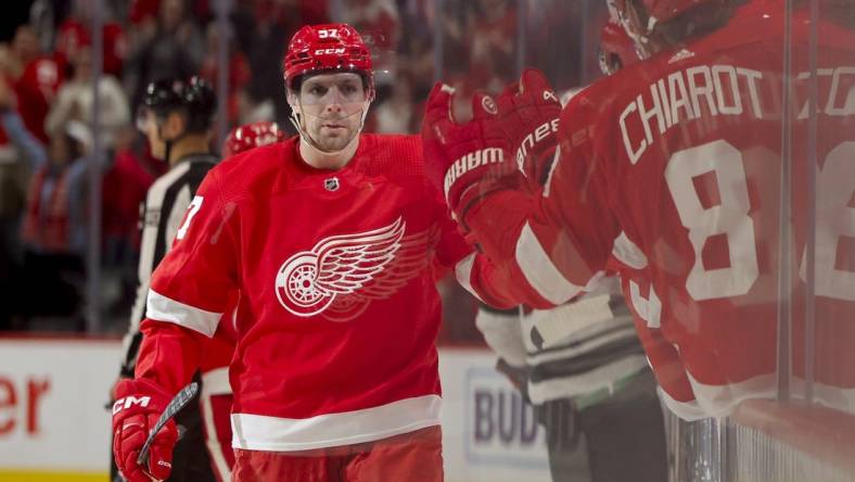 Nov 26, 2023; Detroit, Michigan, USA; Detroit Red Wings left wing David Perron (57) receives congratulations from teammates after scoring in the third period against the Minnesota Wild at Little Caesars Arena. Mandatory Credit: Rick Osentoski-USA TODAY Sports