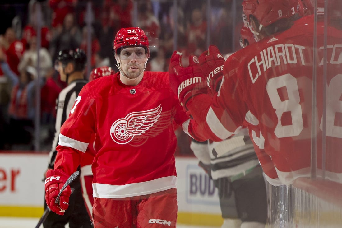 Nov 26, 2023; Detroit, Michigan, USA; Detroit Red Wings left wing David Perron (57) receives congratulations from teammates after scoring in the third period against the Minnesota Wild at Little Caesars Arena. Mandatory Credit: Rick Osentoski-USA TODAY Sports