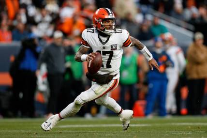 Nov 26, 2023; Denver, Colorado, USA; Cleveland Browns quarterback Dorian Thompson-Robinson (17) scrambles in the backfield in the third quarter against the Denver Broncos at Empower Field at Mile High. Mandatory Credit: Isaiah J. Downing-USA TODAY Sports
