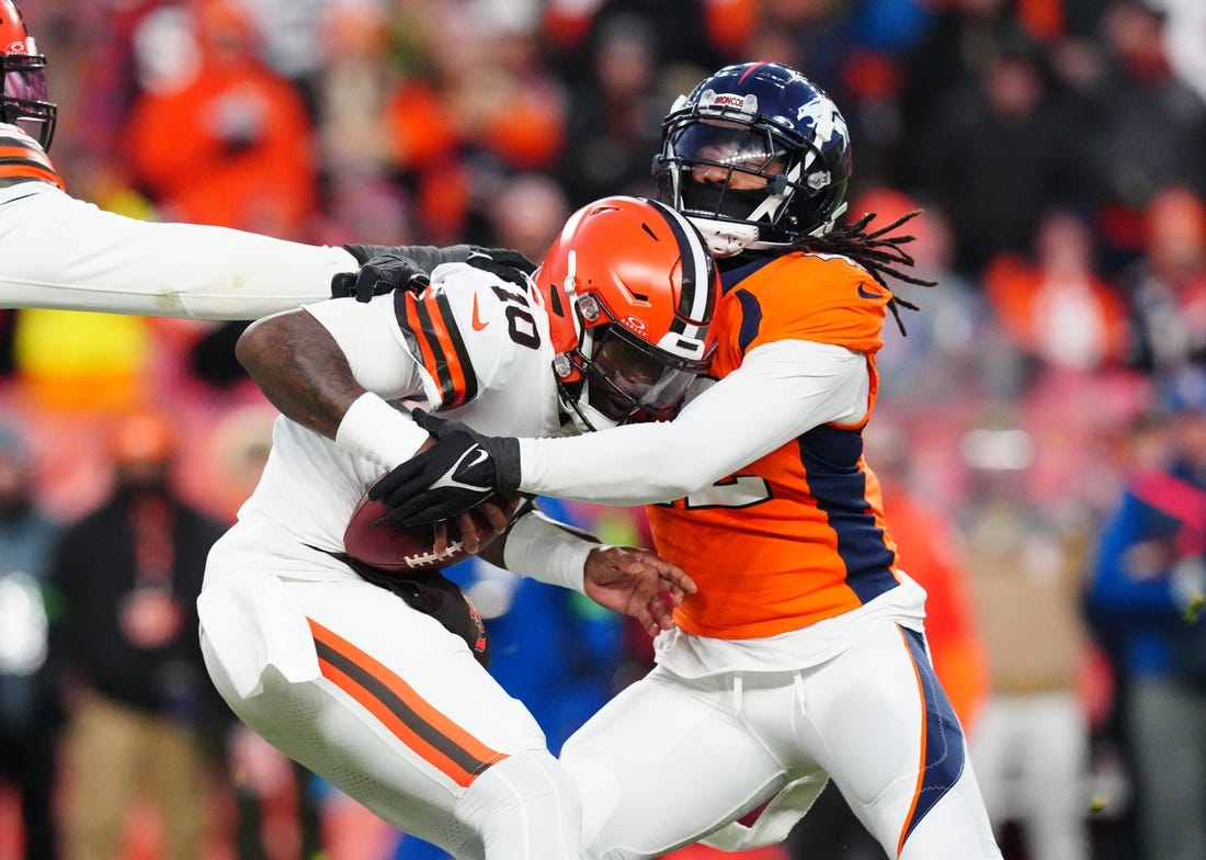 Nov 26, 2023; Denver, Colorado, USA; Denver Broncos linebacker Nik Bonitto (42) sacks Cleveland Browns quarterback PJ Walker (10) in the second half at Empower Field at Mile High. Mandatory Credit: Ron Chenoy-USA TODAY Sports