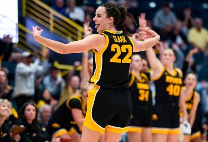 Iowa Hawkeyes guard Caitlin Clark (22) celebrates a three point basket during the third quarter of the Gulf Coast Showcase championship game against the Kansas State Wildcats at Hertz Arena in Estero on Sunday, Nov. 26, 2023.