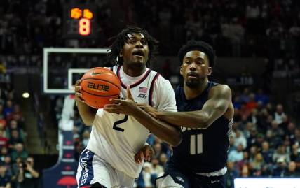 Nov 27, 2023; Storrs, Connecticut, USA; UConn Huskies guard Tristen Newton (2) drives the ball against New Hampshire Wildcats guard Christian Moore (11) in the first half at Harry A. Gampel Pavilion. Mandatory Credit: David Butler II-USA TODAY Sports
