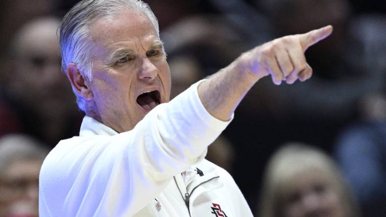 Nov 27, 2023; San Diego, California, USA; San Diego State Aztecs head coach Brian Dutcher gestures during the second half against the Point Loma Nazarene Sea Lions at Viejas Arena. Mandatory Credit: Orlando Ramirez-USA TODAY Sports