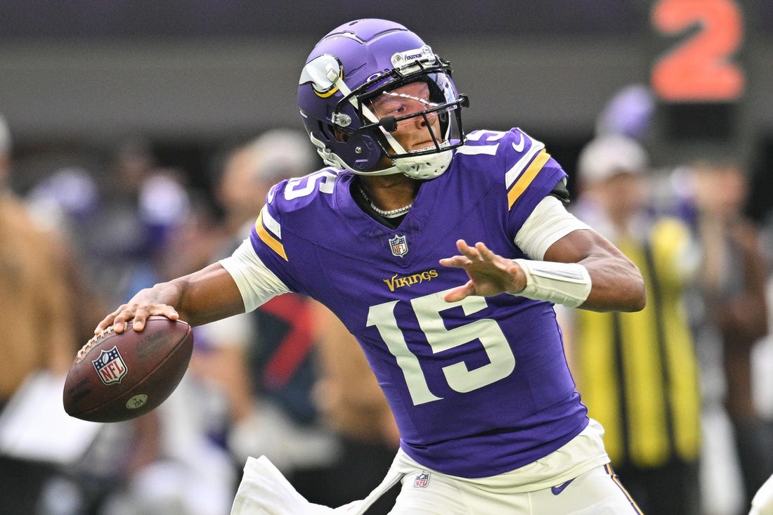 Nov 12, 2023; Minneapolis, Minnesota, USA; Minnesota Vikings quarterback Joshua Dobbs (15) throws a pass against the New Orleans Saints during the first quarter at U.S. Bank Stadium. Mandatory Credit: Jeffrey Becker-USA TODAY Sports