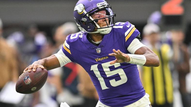 Nov 12, 2023; Minneapolis, Minnesota, USA; Minnesota Vikings quarterback Joshua Dobbs (15) throws a pass against the New Orleans Saints during the first quarter at U.S. Bank Stadium. Mandatory Credit: Jeffrey Becker-USA TODAY Sports