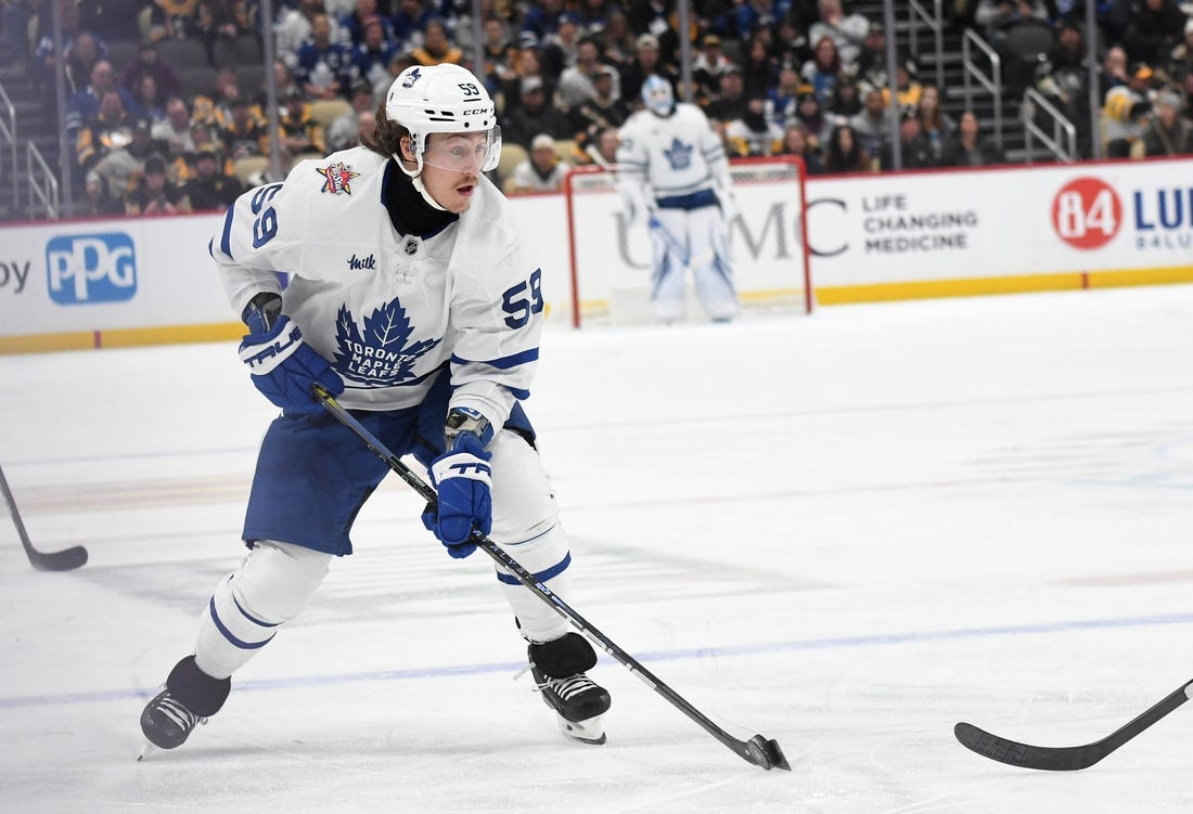 Nov 25, 2023; Pittsburgh, Pennsylvania, USA;  Toronto Maple Leafs left wing Tyler Bertuzzi (59) moves the puck against the Pittsburgh Penguins during the second period at PPG Paints Arena. Mandatory Credit: Philip G. Pavely-USA TODAY Sports