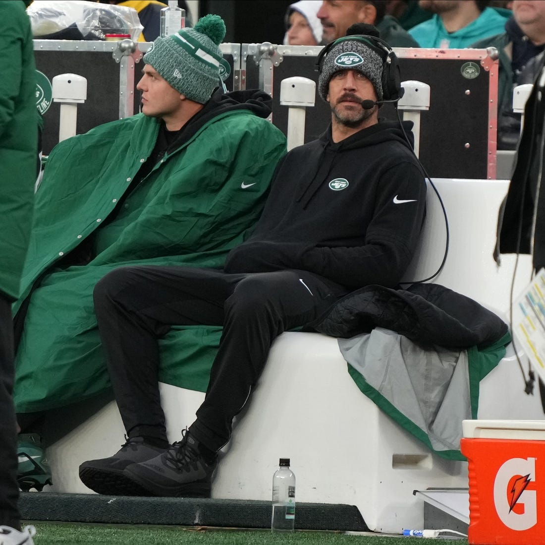Zach Wilson and Aaron Rodgers watch the Jets' game against the Dolphins on Friday.