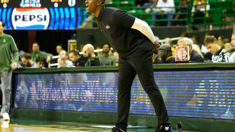 Nov 28, 2023; Waco, Texas, USA;  Nicholls State Colonels head coach Tevon Saddler calls a play against the Baylor Bears during the first half at Ferrell Center. Mandatory Credit: Chris Jones-USA TODAY Sports