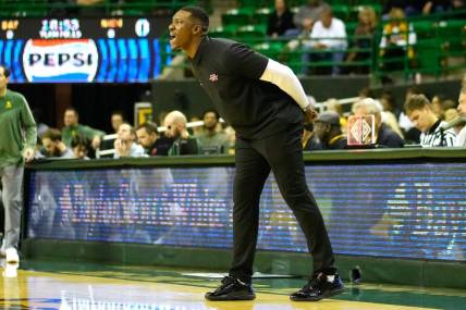 Nov 28, 2023; Waco, Texas, USA;  Nicholls State Colonels head coach Tevon Saddler calls a play against the Baylor Bears during the first half at Ferrell Center. Mandatory Credit: Chris Jones-USA TODAY Sports