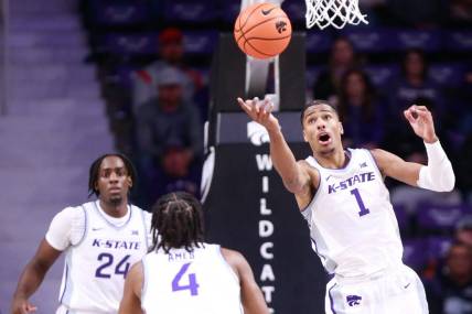 Kansas State senior wing David N'Guessan (1) reaches for a rebound during the first half of Tuesday's game against Oral Roberts inside Bramlage Coliseum.
