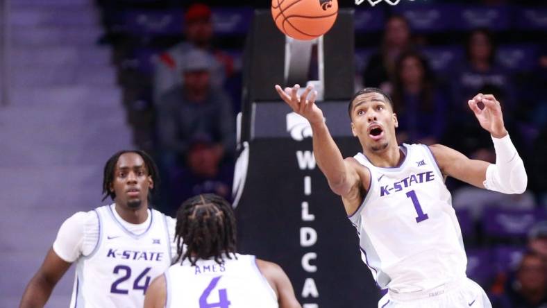 Kansas State senior wing David N'Guessan (1) reaches for a rebound during the first half of Tuesday's game against Oral Roberts inside Bramlage Coliseum.