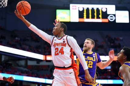 Nov 28, 2023; Syracuse, New York, USA; Syracuse Orange guard Quadir Copeland (24) shoots the ball in front of LSU Tigers forward Hunter Dean (12) during the second half at the JMA Wireless Dome. Mandatory Credit: Rich Barnes-USA TODAY Sports