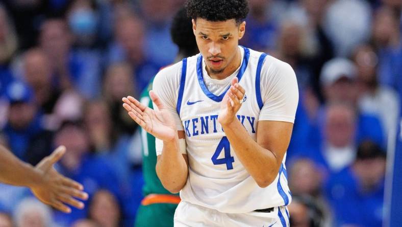 Nov 28, 2023; Lexington, Kentucky, USA; Kentucky Wildcats forward Tre Mitchell (4) reacts during the first half against the Miami (Fl) Hurricanes at Rupp Arena at Central Bank Center. Mandatory Credit: Jordan Prather-USA TODAY Sports