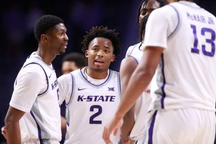 Kansas State graduate transfer guard Tylor Perry (2) brings in his teammates to a huddle during overtime of Tuesday's game against Oral Roberts inside Bramlage Coliseum.