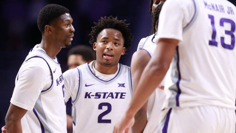 Kansas State graduate transfer guard Tylor Perry (2) brings in his teammates to a huddle during overtime of Tuesday's game against Oral Roberts inside Bramlage Coliseum.