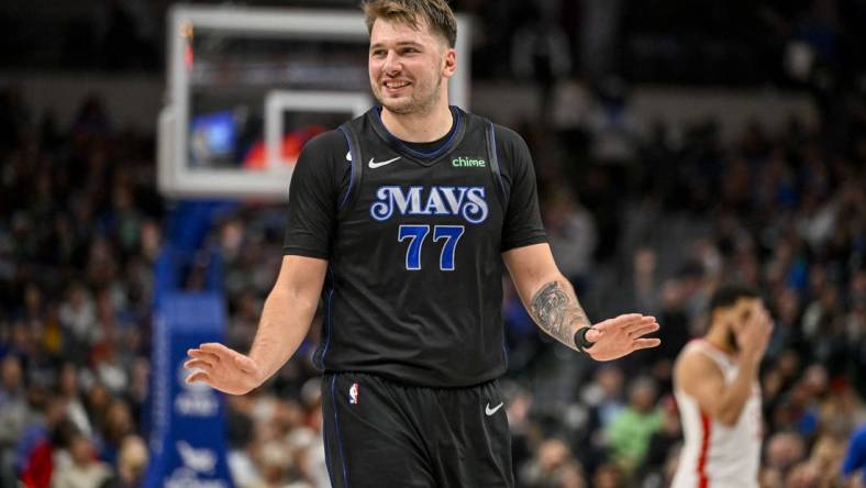 Nov 28, 2023; Dallas, Texas, USA; Dallas Mavericks guard Luka Doncic (77) reacts to a foul call against the Houston Rockets during the second half at the American Airlines Center. Mandatory Credit: Jerome Miron-USA TODAY Sports