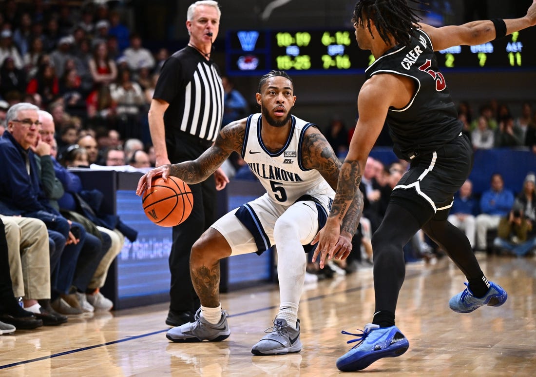 Nov 29, 2023; Villanova, Pennsylvania, USA; Villanova Wildcats guard Justin Moore (5) dribbles the ball against Saint Joseph's Hawks guard Lynn Greer III (5) in the first half at William B. Finneran Pavilion. Mandatory Credit: Kyle Ross-USA TODAY Sports