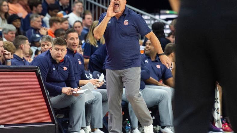 Auburn Tigers head coach Bruce Pearl talks with his team from the sideline as Auburn Tigers take on Virginia Tech Hokies at Neville Arena in Auburn, Ala., on Wednesday, Nov. 29, 2023. Auburn Tigers leads Virginia Tech Hokies 33-24 at halftime.