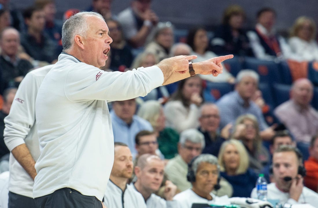 Virginia Tech Hokies head coach Mike Young talks with his team on the sideline as Auburn Tigers take on Virginia Tech Hokies at Neville Arena in Auburn, Ala., on Wednesday, Nov. 29, 2023. Auburn Tigers leads Virginia Tech Hokies 33-24 at halftime.